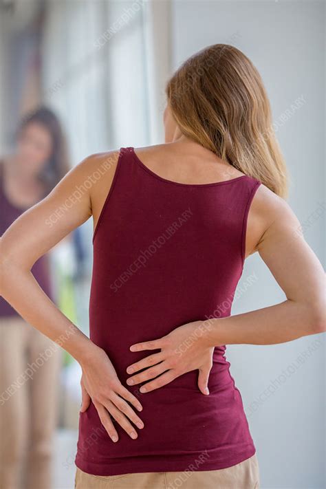 Woman Suffering From Back Pain Stock Image C033 2329 Science