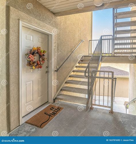 Square Front Door of Apartment from Exterior Stairwell Stock Photo ...