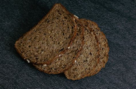 Four Slices Of Bread With Sunflower Seeds On The Table Stock Photo