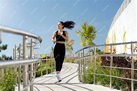 Premium Photo | Woman jogging or running wearing sportswear doing ...