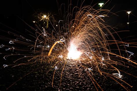 Yellow Ground Fireworks on Asphalt.. Stock Photo - Image of long ...