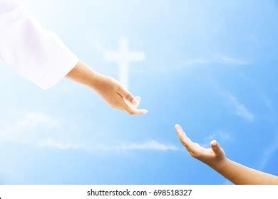 Jesus Reaching Out Hand Photos and Images