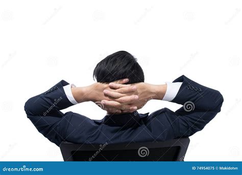 Young Businessman Resting On Armchair With His Hands Behind His Head