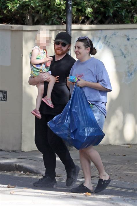 Rupert Grint scoops up daughter Wednesday, 3, and carries her to toy ...