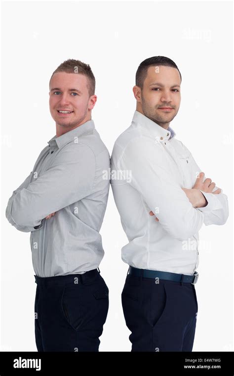 Two Men Standing Back To Back Stock Photo Alamy