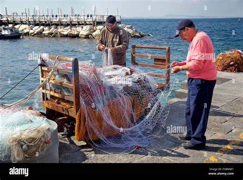 Fishing Port Men Mending Nets Hi Res Stock Photography And Images Alamy