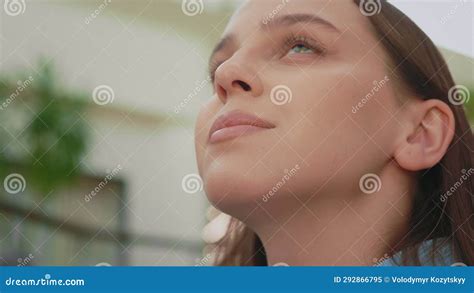 Close Up Of The Woman Face Looking Up Standing Inside Shopping Mall