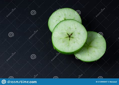 Green Apple On A Dark Background A Cut Green Apple On A Black