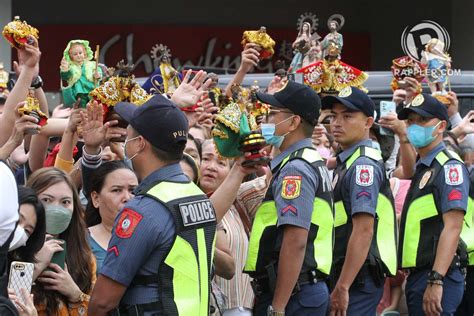 Devotees gather outside the Basilica Minore del Santo Niño de Cebu to