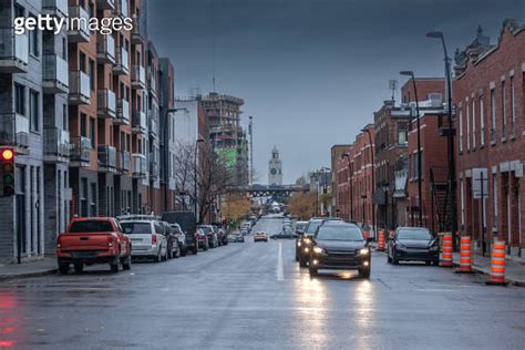 Selective Blur On Cars Driving At Dusk In Saint Henri District Of