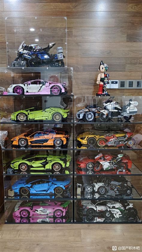 A Display Case Filled With Lots Of Different Colored Toy Cars On Top Of