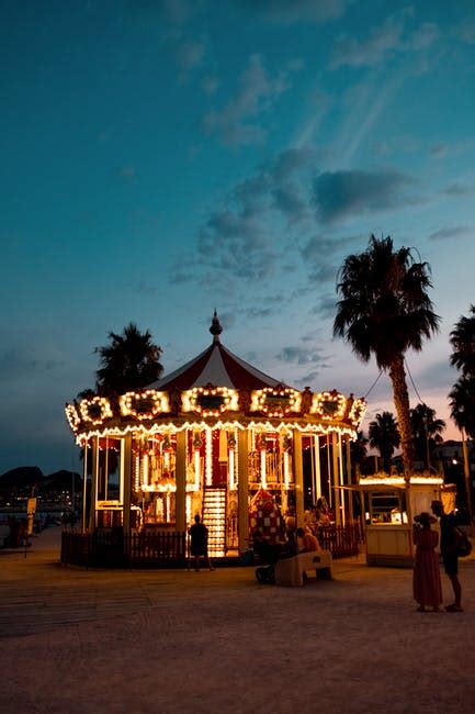 Colorful carousel in amusement park at night · Free Stock Photo