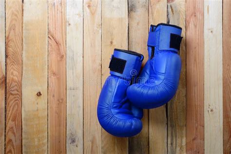 Pair Of Blue Boxing Gloves Hanging On The Wall Stock Image Image Of