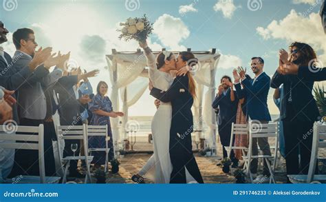 Attractive Female Couple Walking Up The Aisle At Outdoors Wedding