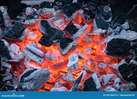 Closeup Of Glowing And Flaming Pieces Of Coal Ready To Start A