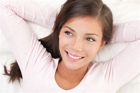 Woman Smiling In Bed Stock Photo Ariwasabi 22925640