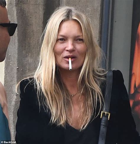 Kate Moss Enjoys A Cigarette And Bumps Into David Furnish In London