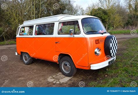 Classic Volkswagen Camper Van In White And Orange Editorial