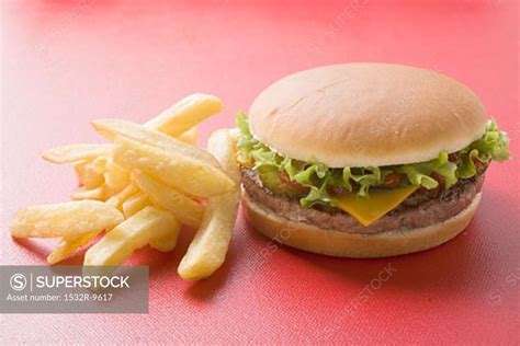 Cheeseburger with chips - SuperStock