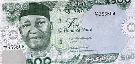 Photos Buhari Unveils Redesigned 200 500 And 1000 Naira Notes