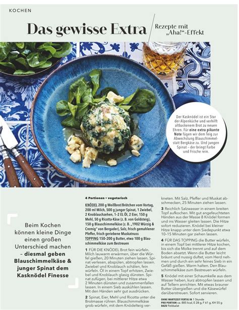 A Blue Plate Filled With Food On Top Of A Table