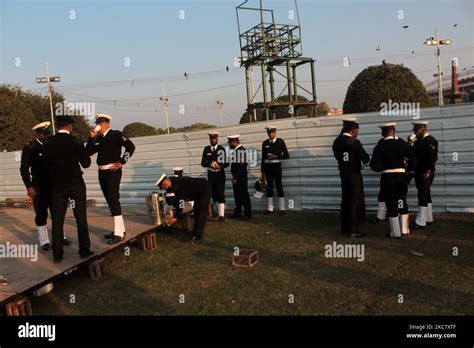 Indian Naval Force Personnel Take Refreshments After The Beating