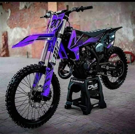 Purple And Black Dirt Bike On Brick Floor
