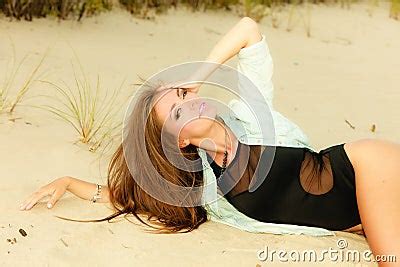 Adorable Girl Lying On Sandy Beach Stock Photography | CartoonDealer.com #60272594