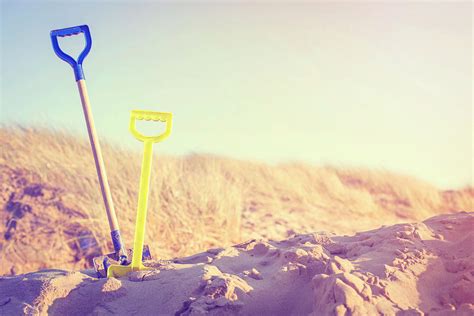 Two Spades In Sand On Beach Photograph By Sally Anscombe Fine Art America