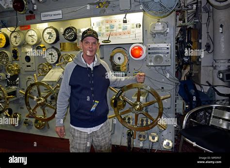 US Navy Vietnam Veteran hand on the throttle in the engine room ...