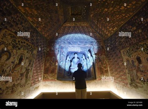 HANGZHOU, CHINA - MARCH 16, 2022 - Visitors view the 3D-printed restoration of Cave 45 of ...