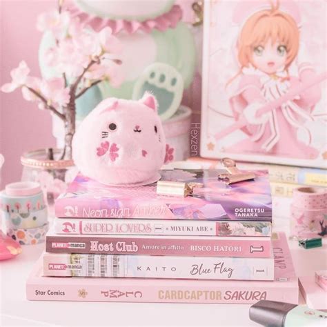 🐱 Heres A Sakura Neko Dango Plush Chilling On A Stack Of Mangas 🌸