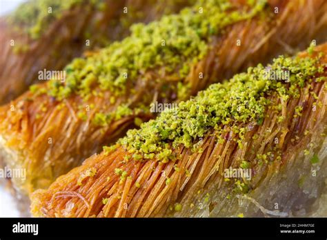 Turkish famous dessert burma kadayif on plate with pistachio Stock ...