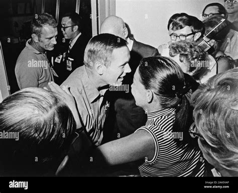 Astronaut Neil A Armstrong Center Is Greeted By Friends In The Crew Reception Area Of The