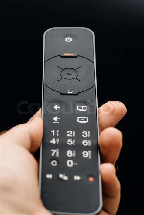 Male Hand Holding Modern Wireless Remote Control Stock Image Colourbox