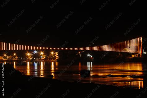 View of the Ram Jhula suspension bridge at night in Rishikesh ...