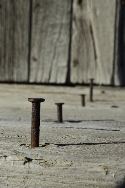 Premium Photo Close Up Of Rusty Nails On Wood