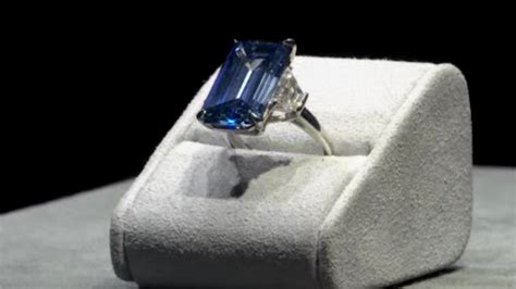 'Oppenheimer Blue' diamond sells for record $57.6 million at auction ...