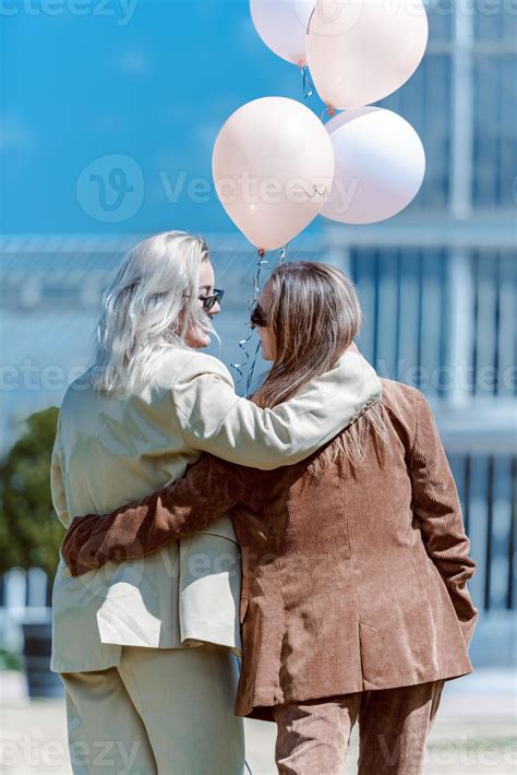 LGBT Lesbian Couple Love Moments Lesbian Couple Holding Balloons In