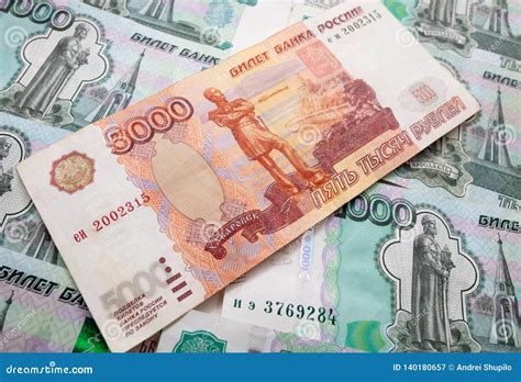 Dollars and Russian Rubles on the Table As Background Stock Image