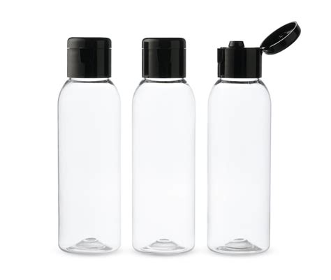 Premium Photo Three Clear Plastic Bottles With Black Caps On A White