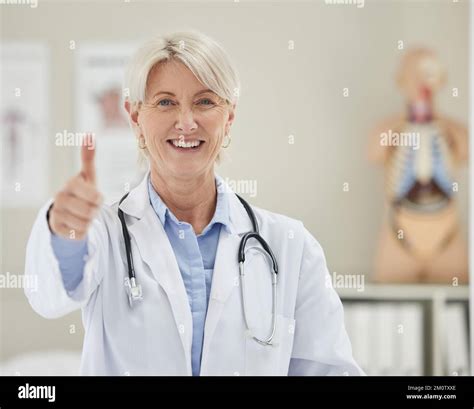 She Always Gives Good News A Mature Doctor Giving The The Thumbs Up