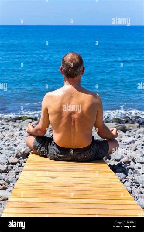 Man Meditating Beach Hi Res Stock Photography And Images Alamy