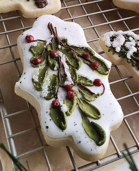 Decorated Cookies Sitting On Top Of A Cooling Rack