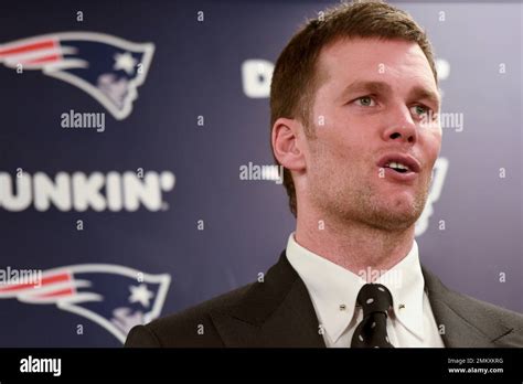 New England Patriots Quarterback Tom Brady Talks To Reporters During