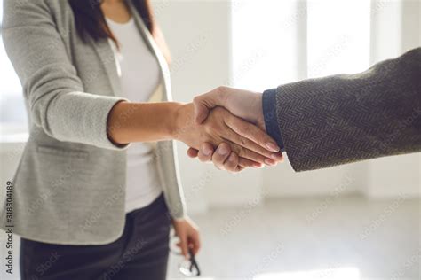 Handshake Of Businesspeople Female And Male Hand Makes A Handshake In