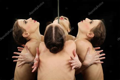 Naked Ballerina Dancer Looking At The Mirror Stock Photo