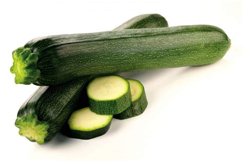 Download Caption Fresh Zucchini With Sliced Pieces Close Up Wallpaper