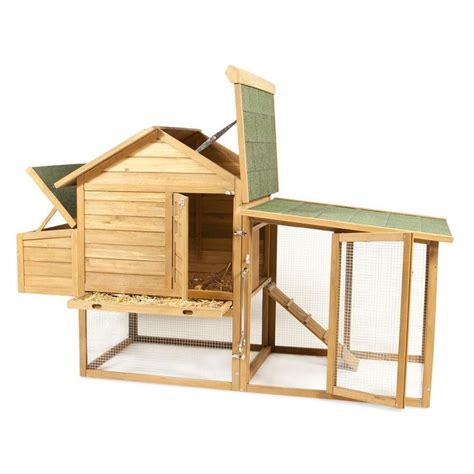 A Small Wooden Chicken Coop With A Green Roof And Door On The Outside