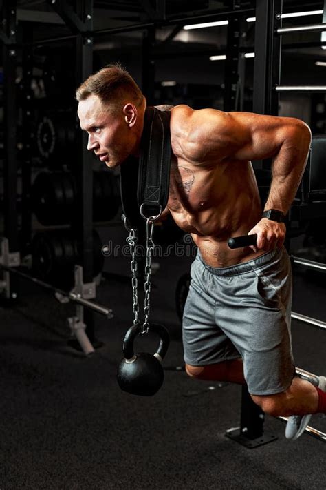 Closeup Portrait Of A Muscular Man Workout With Barbell At Gym Brutal